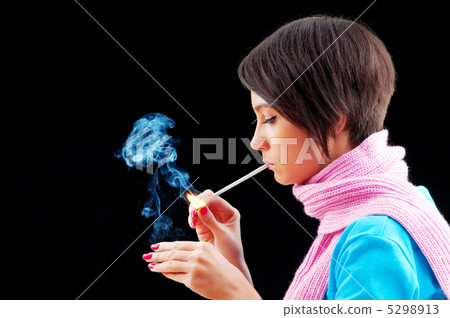 Young girl smoking on black Young girl smoking on black 5298913