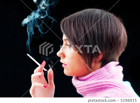 Young girl smoking on black 5298915