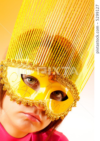 Attractive woman posing in the stylish mask 5299127