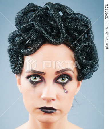 Woman depicting the concept og Evil (Medusa Gorgon) 5299178