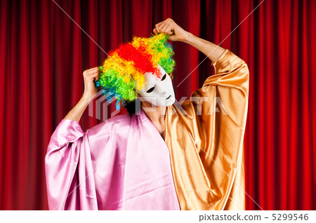 Stock Photo: Actor with maks in a funny theater concept