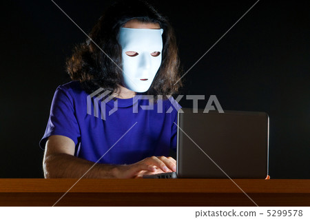 Hacker sitting in dark room Hacker sitting in dark room 5299578
