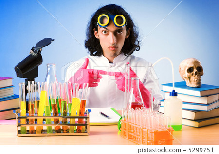 Chemist in the lab experimenting with solutions Chemist in the lab experimenting with solutions 5299751