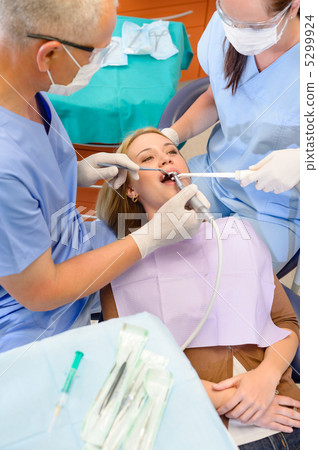 Woman at dentist surgery have treatment 5299924