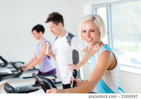 Fitness young people on treadmill running exercise Fitness young people on treadmill running exercise 5300097