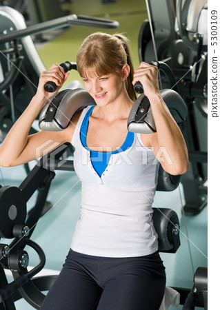 Fitness center young woman exercise abdominal 5300109