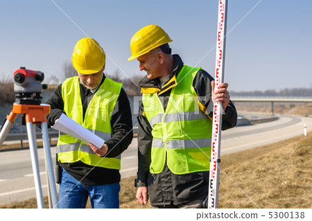 Geodesist two man theodolite stand highway 5300138