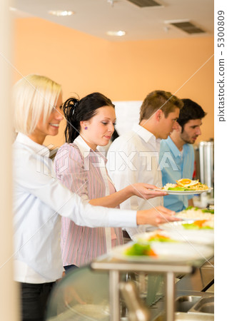 Young business colleagues queue canteen lunch Young business colleagues queue canteen lunch 5300809