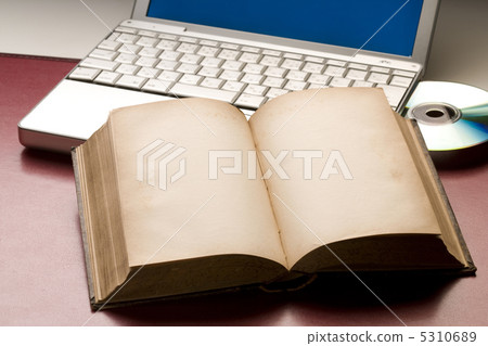 Antique book and personal computer 5310689