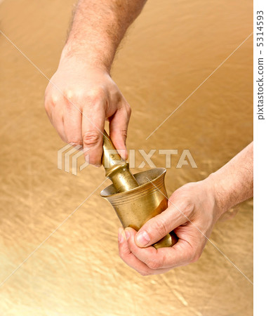 Close up of man hands with mortar and pestle 5314593