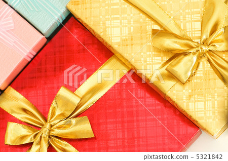 Close up of gift boxes with golden ribbons Close up of gift boxes with golden ribbons 5321842