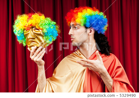 Actor with maks in a funny theater concept Actor with maks in a funny theater concept 5329490