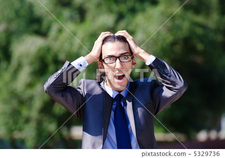 Young businessman at the street scene Young businessman at the street scene 5329736