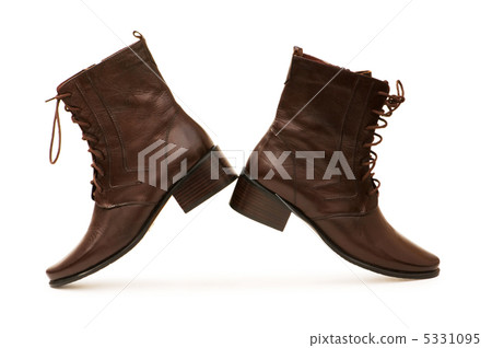 Brown boots isolated on the white background Brown boots isolated on the white background 5331095