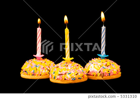 Cupcakes and candles isolated on the white background Cupcakes and candles isolated on the white background 5331310