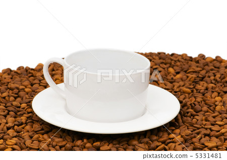 White cup on the background of coffee beans White cup on the background of coffee beans 5331481