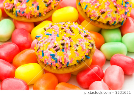 Sweet cakes and colourful gums at the background Sweet cakes and colourful gums at the background 5331631