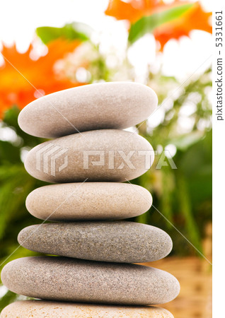 Stack of spa pebbles against blurred background 5331661