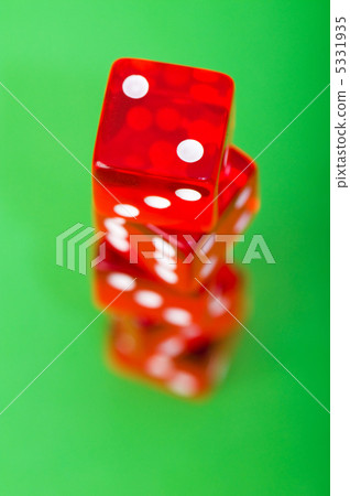 Red dice against green background - shallow DOF 5331935
