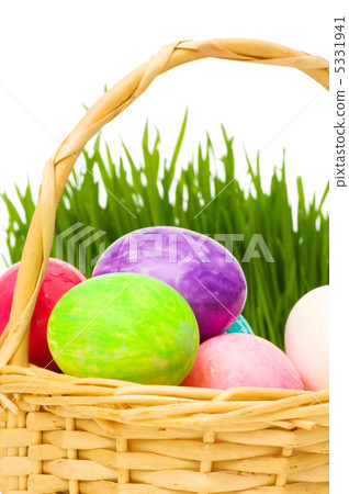 Eggs in the basket and grass isolated on white Eggs in the basket and grass isolated on white 5331941
