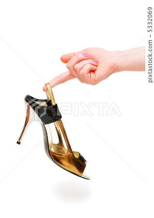 Hand holding woman shoe isolated on white Hand holding woman shoe isolated on white 5332069