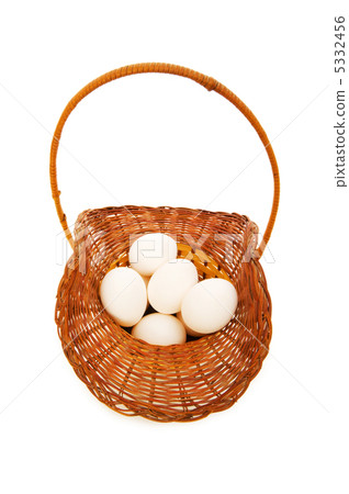 Basket full of eggs isolated on white 5332456