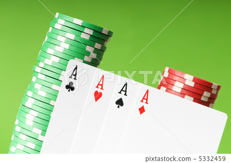 Casino chips and four aces against green background Casino chips and four aces against green background 5332459