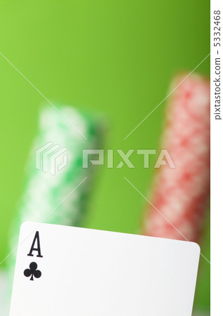 Casino chips and four aces against green background Casino chips and four aces against green background 5332468