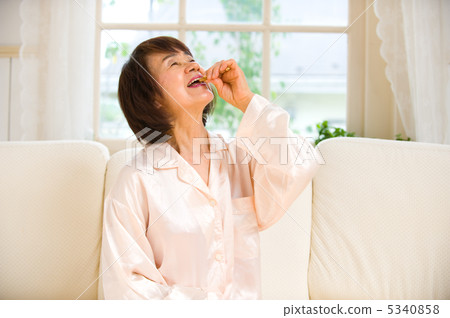 senior woman taking medicine 5340858