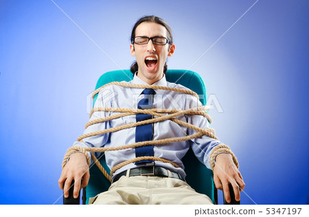 Young businessman tied with rope Young businessman tied with rope 5347197