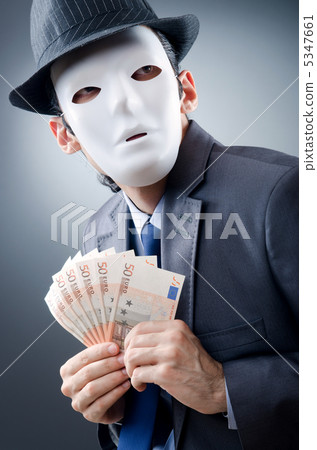 Businessman with money and mask Businessman with money and mask 5347661