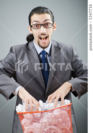 Man with lots of wasted paper Man with lots of wasted paper 5347716