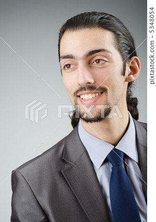 Young businessman in studio shooting 5348054