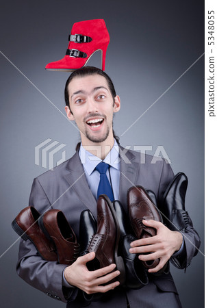 Man with a selection of shoes Man with a selection of shoes 5348055