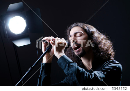 Man singing at the concert 5348552