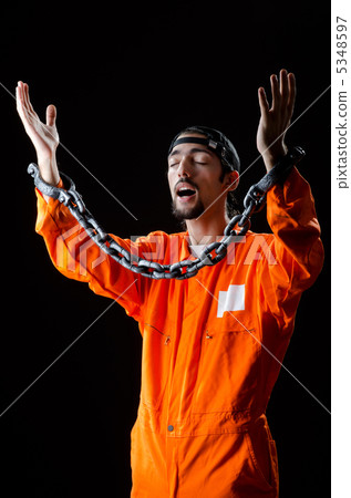 Inmate chained on black background Inmate chained on black background 5348597