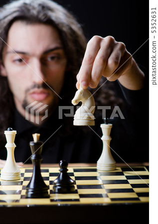 Chess player playing his game Chess player playing his game 5352631