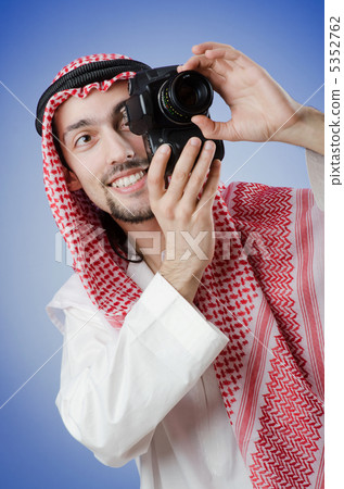 Arab photographer in studio shooting Arab photographer in studio shooting 5352762
