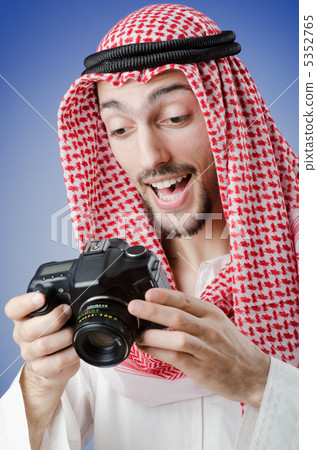 Arab photographer in studio shooting Arab photographer in studio shooting 5352765
