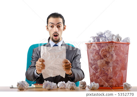 Man with lots of wasted paper 5352770