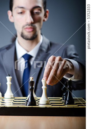 Chess player playing his game Chess player playing his game 5352833