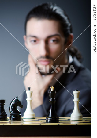 Chess player playing his game Chess player playing his game 5352837