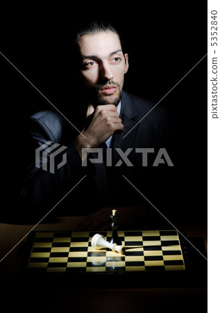 Chess player playing his game Chess player playing his game 5352840