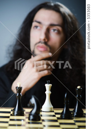 Chess player playing his game Chess player playing his game 5353083