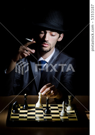 Chess player playing his game Chess player playing his game 5353187
