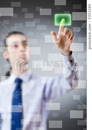 Businessman pressing virtual buttons Businessman pressing virtual buttons 5353384