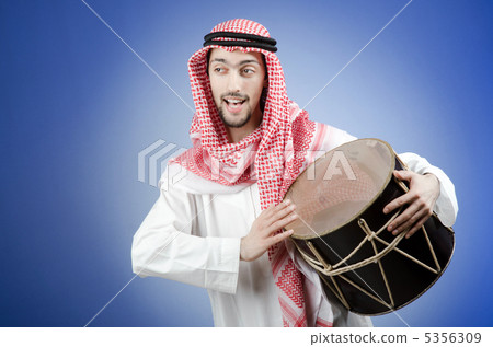 Arab playing drum in studio shooting Arab playing drum in studio shooting 5356309