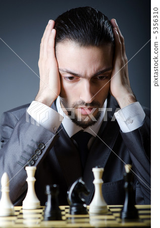 Chess player playing his game Chess player playing his game 5356310