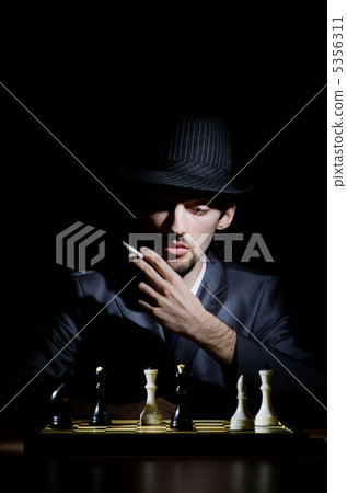 Chess player playing his game Chess player playing his game 5356311