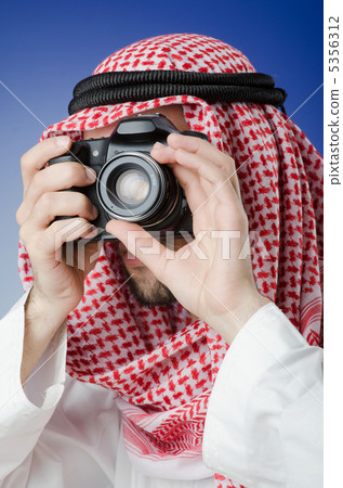 Arab photographer in studio shooting Arab photographer in studio shooting 5356312